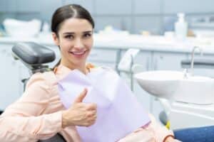 Woman is calm at the dentist after receiving oral conscious sedation to ease her anxiety